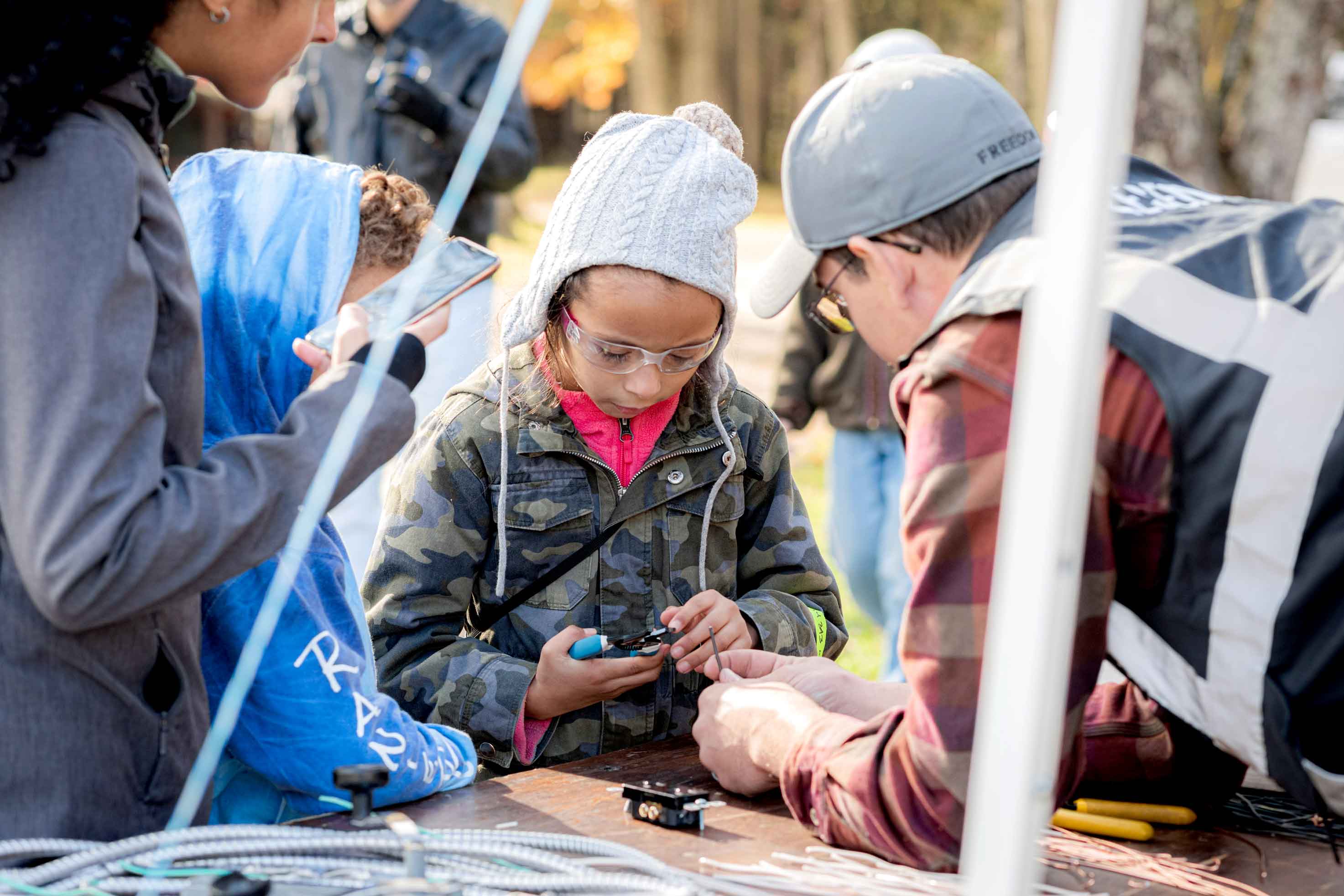 Group of kids learning about wiring.