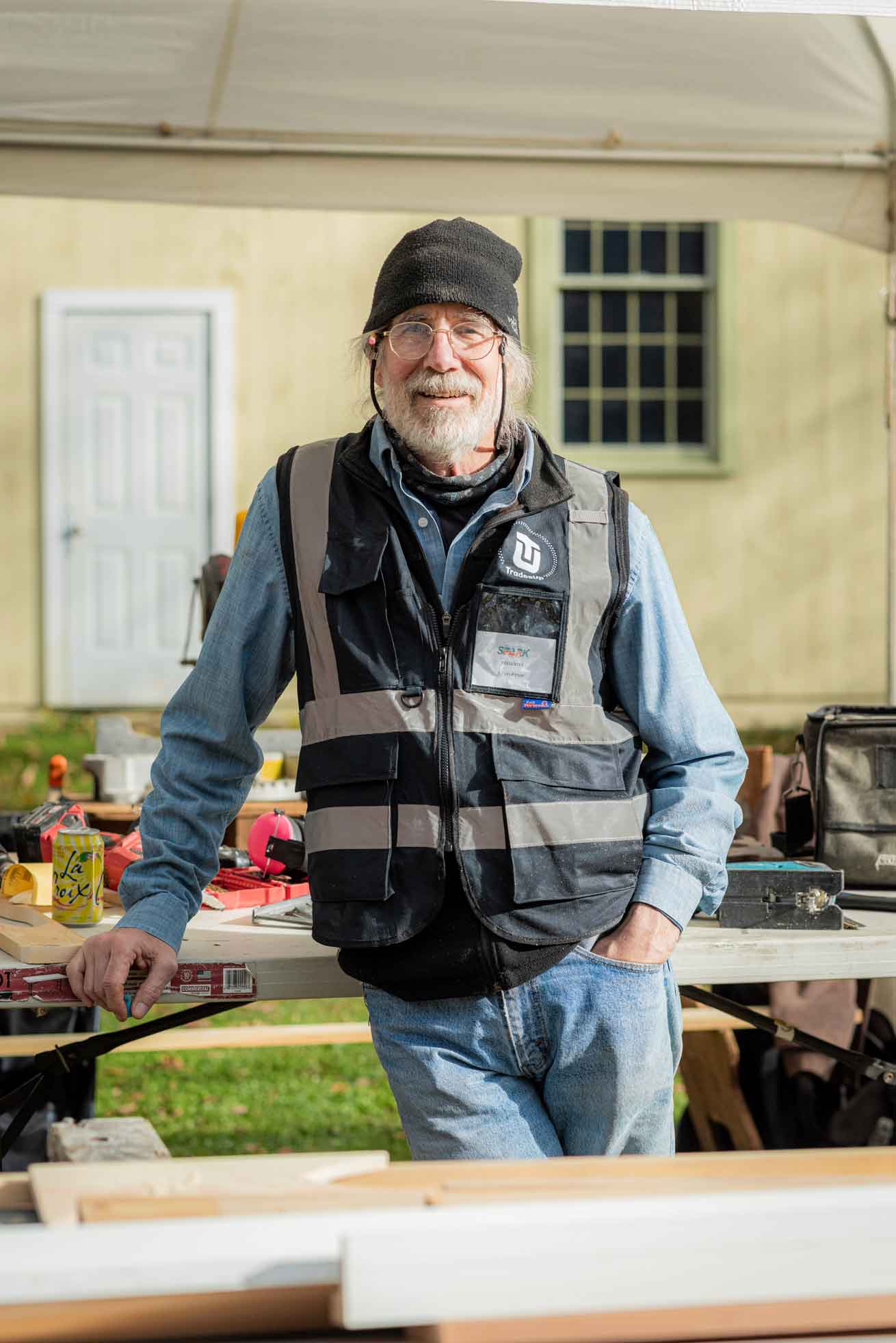 Friendly man in TU vest looking at camera.