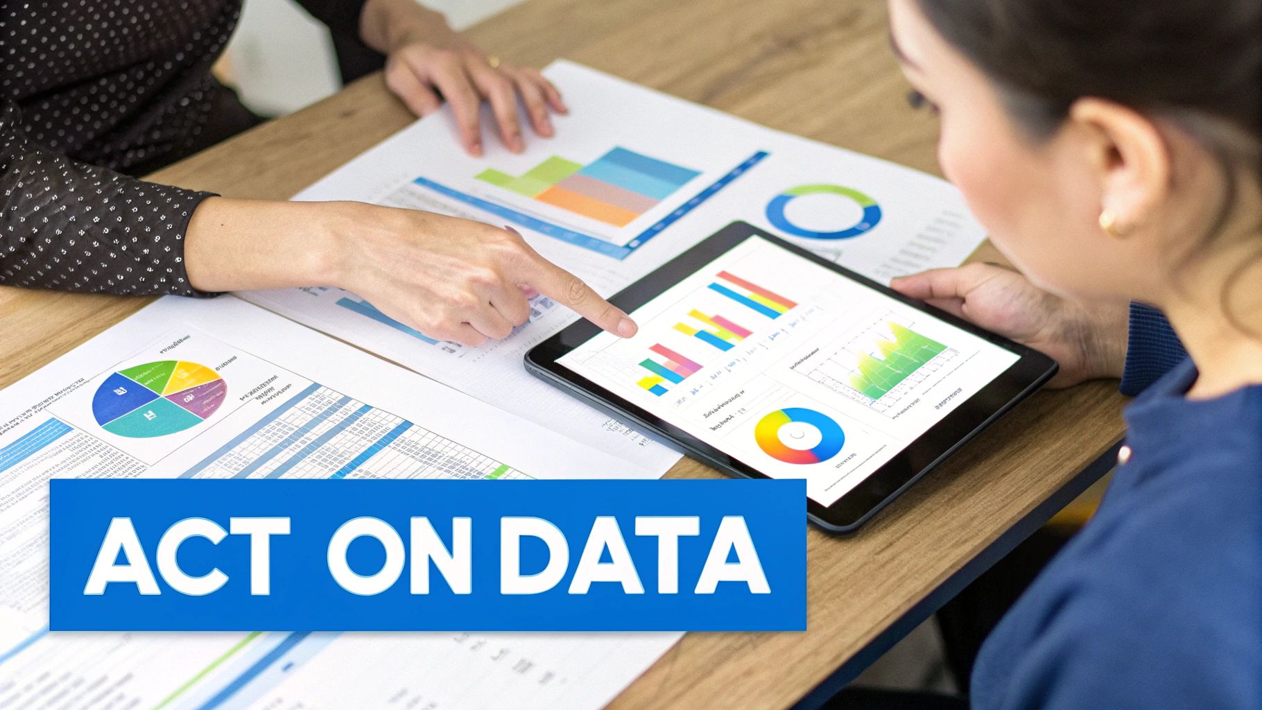 Two professionals analyze business data on a tablet and printed reports, with text 'ACT ON DATA'.