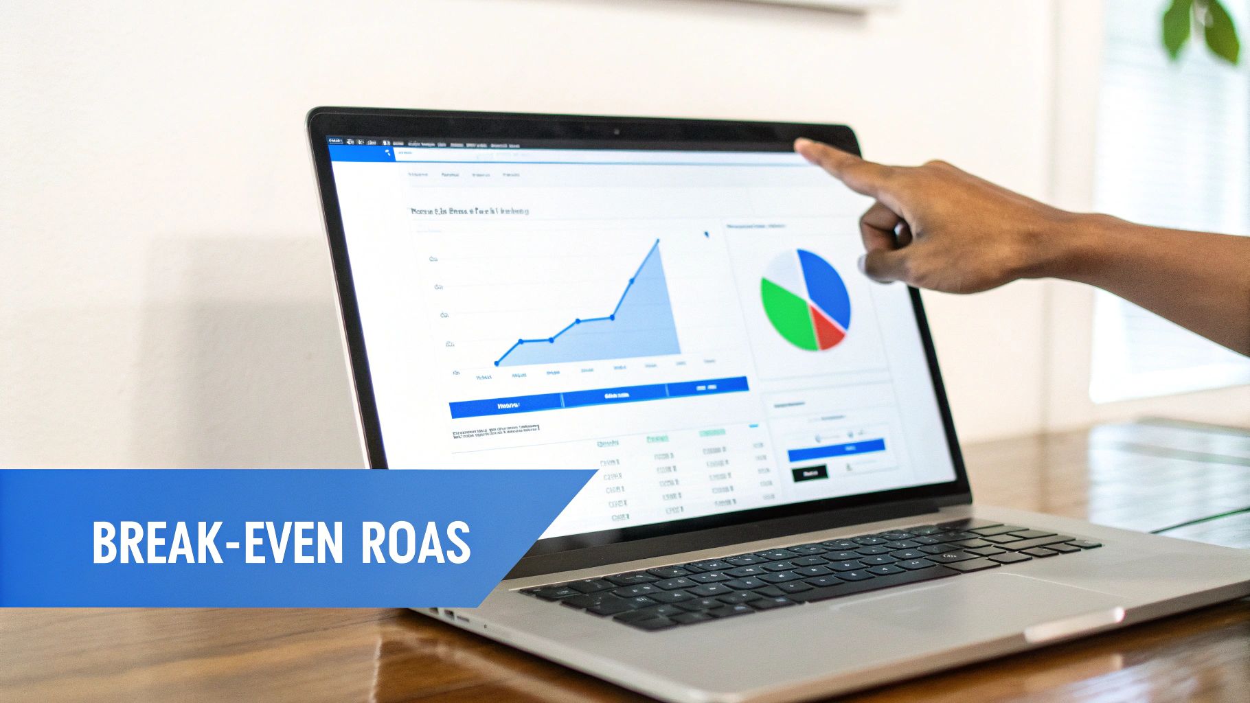 A hand points at a laptop screen showing a line graph, pie chart, and data tables for analysis.