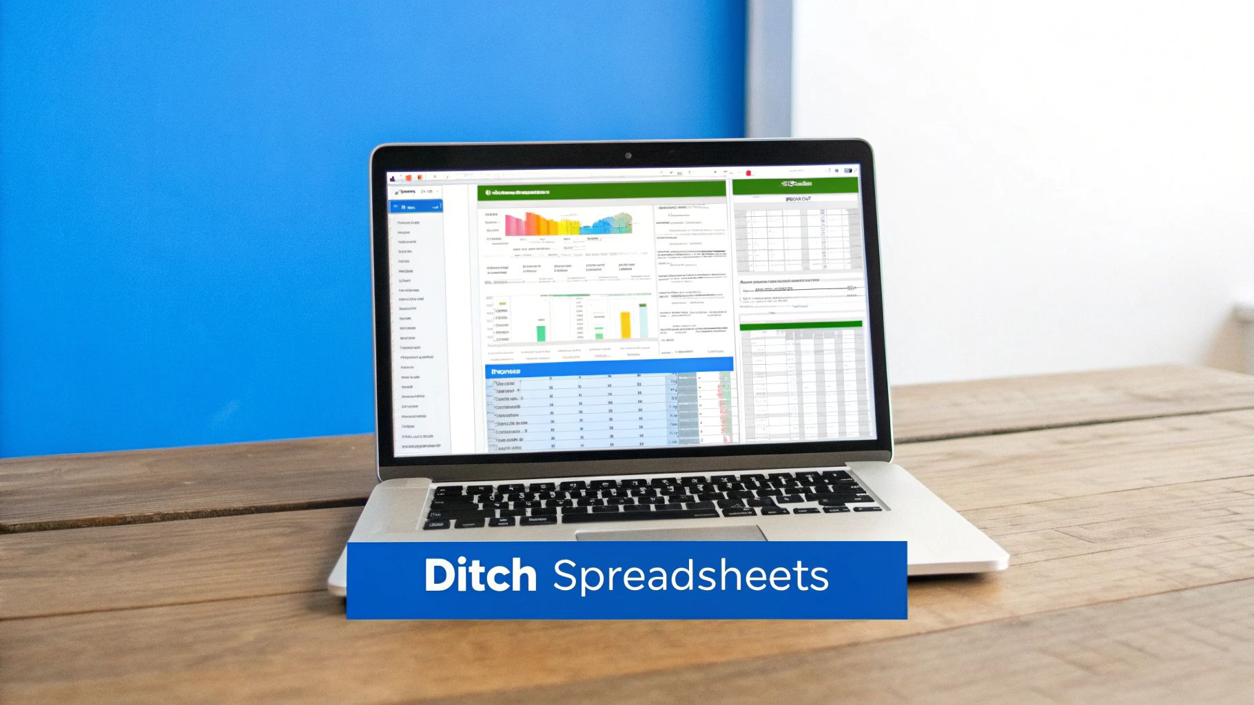 A laptop on a wooden desk displaying a marketing analytics software with charts and data, against a blue wall.