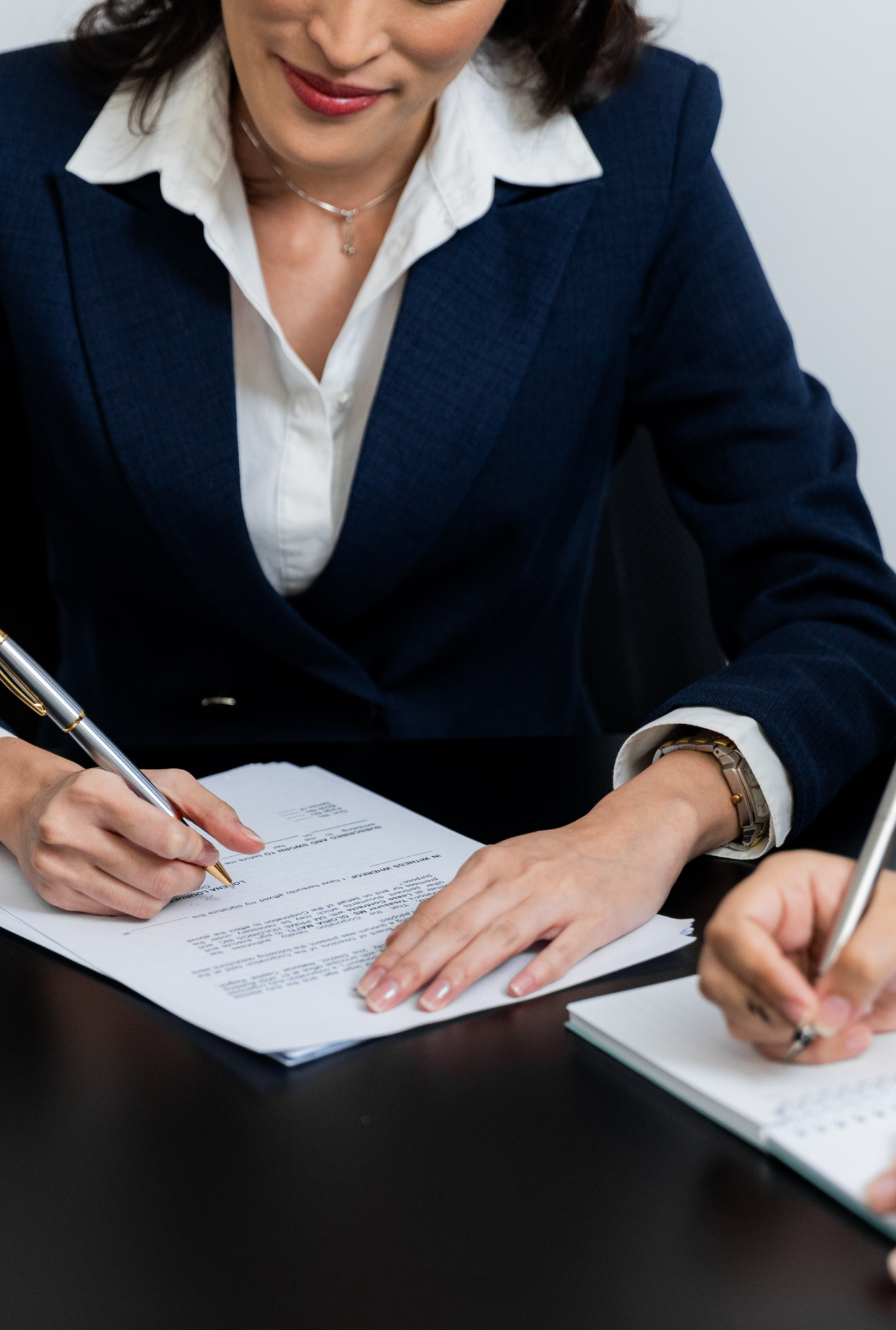 A lady writing on paper
