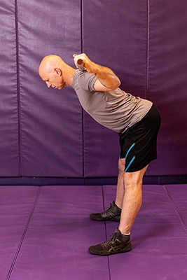 man demonstrating good morning exercise