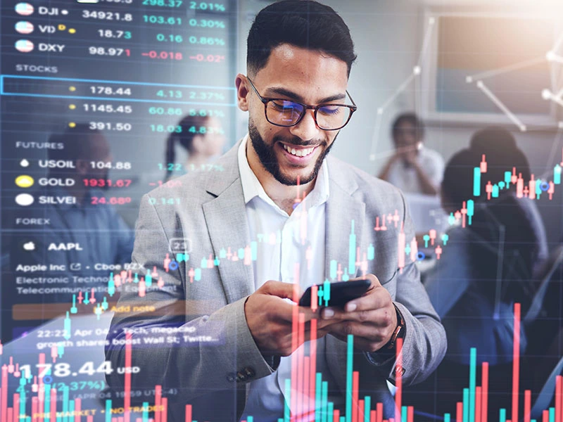 man checking his stock market investments on his mobile phone