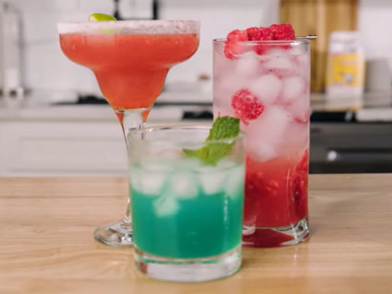 three non-alcoholic drinks displayed on kitchen counter