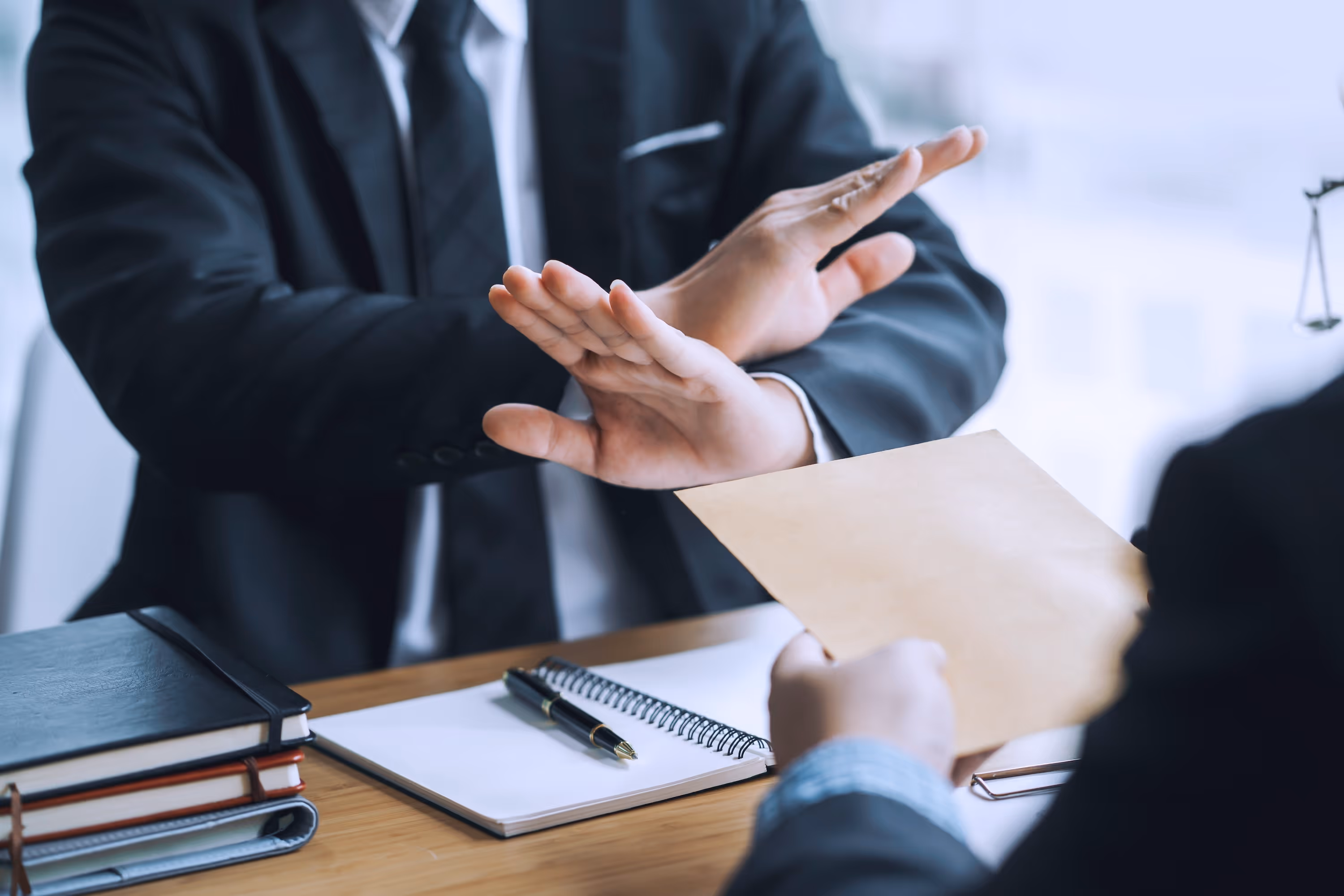 Merchant Cash Advances are not loans: A professional in a suit making a stop gesture to clarify the legal distinction of MCA debt.