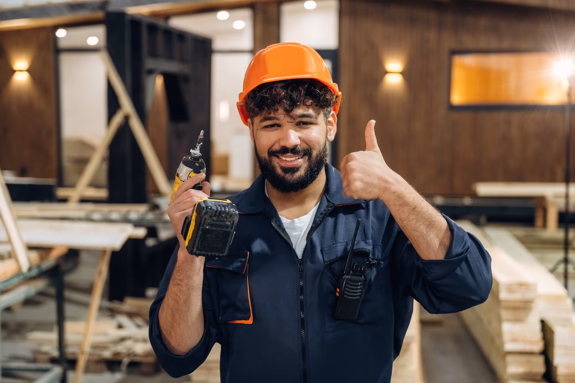 How to handle an MCA default and find relief: A smiling construction business owner giving a thumbs up after restructuring.
