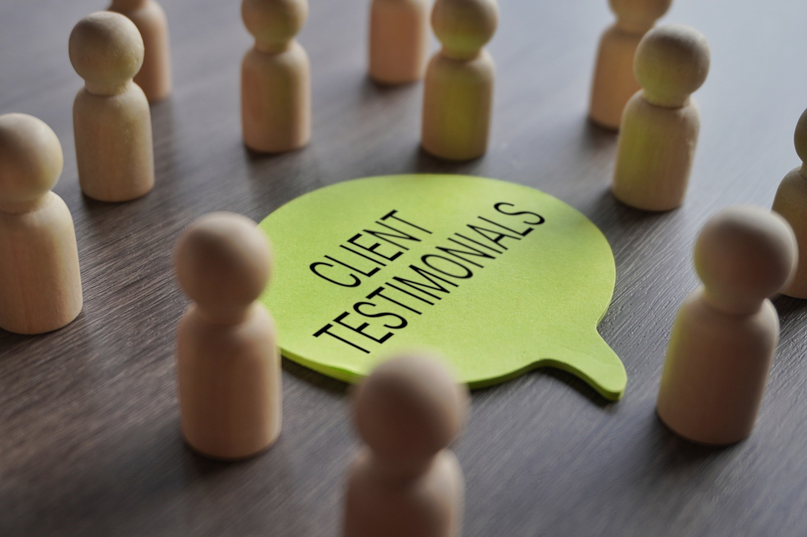 Speech bubble displaying ‘Client Testimonials’ surrounded by people figures, representing Coastal Debt Resolve reviews, customer feedback, trust, transparency, and ethical commercial debt relief services for small businesses.