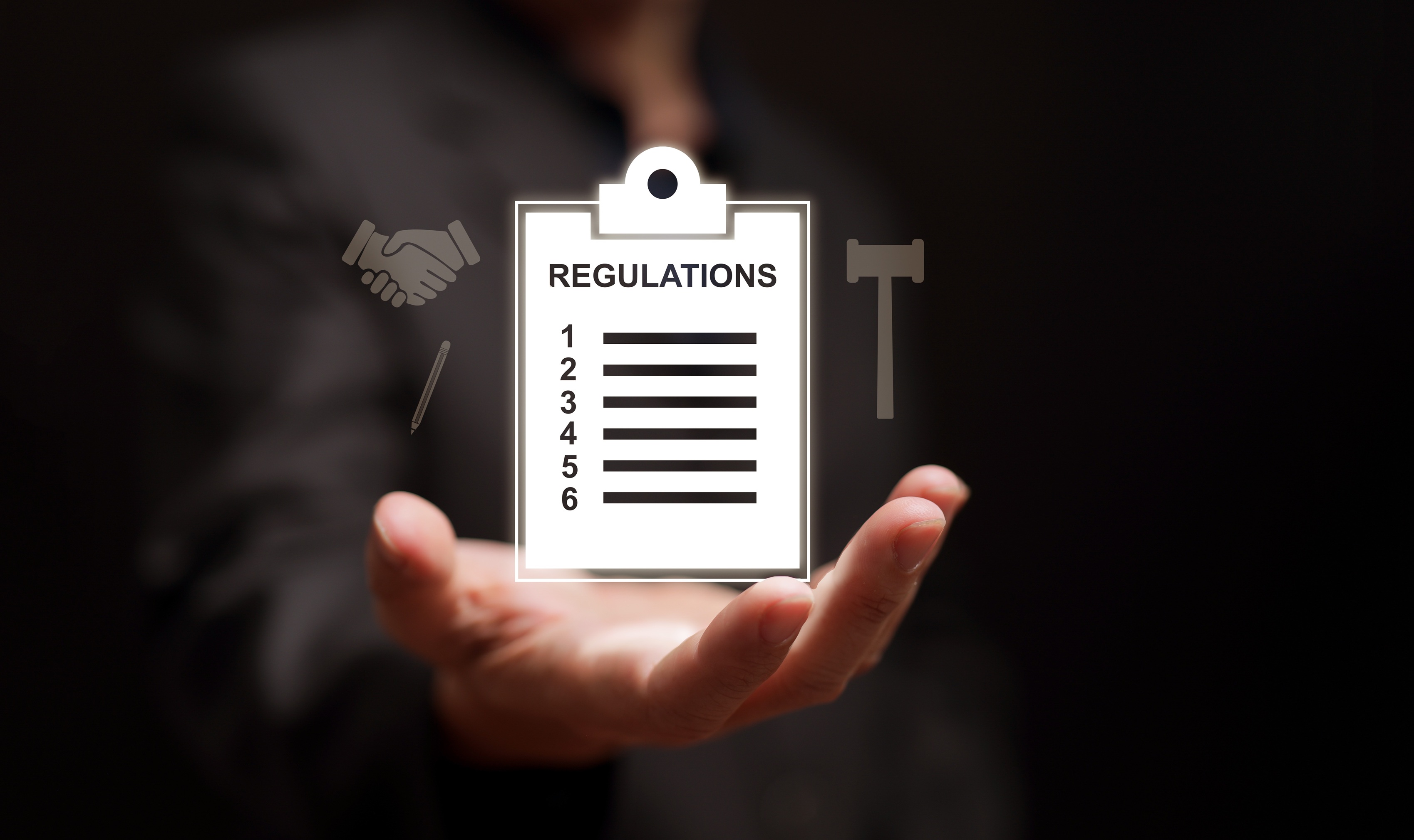 A conceptual illustration of a hand holding a glowing digital clipboard labeled "REGULATIONS" representing Coastal Debt Resolve's commitment to helping businesses with MCA debt.