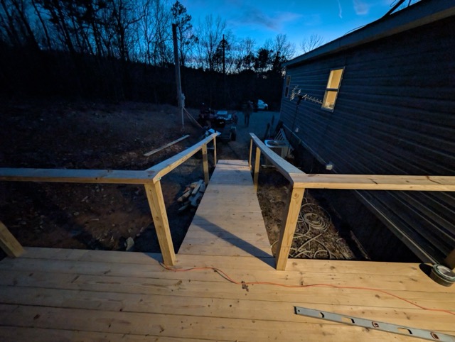 Newly built wooden wheelchair ramp at residential home during evening