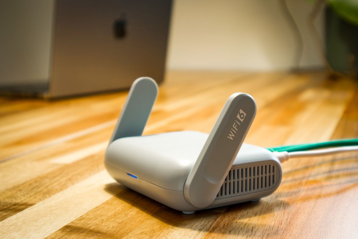 Modern WiFi 6 router on a desk, representing home and small office wireless coverage