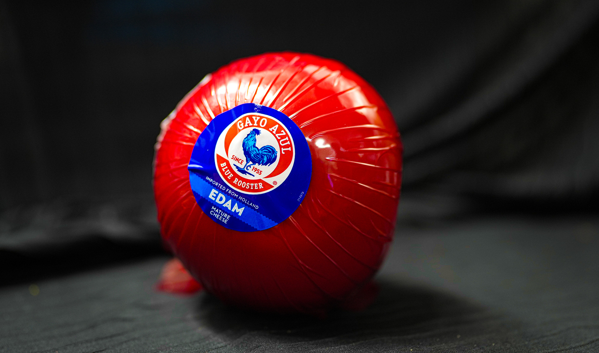 roll of cheese in red packaging