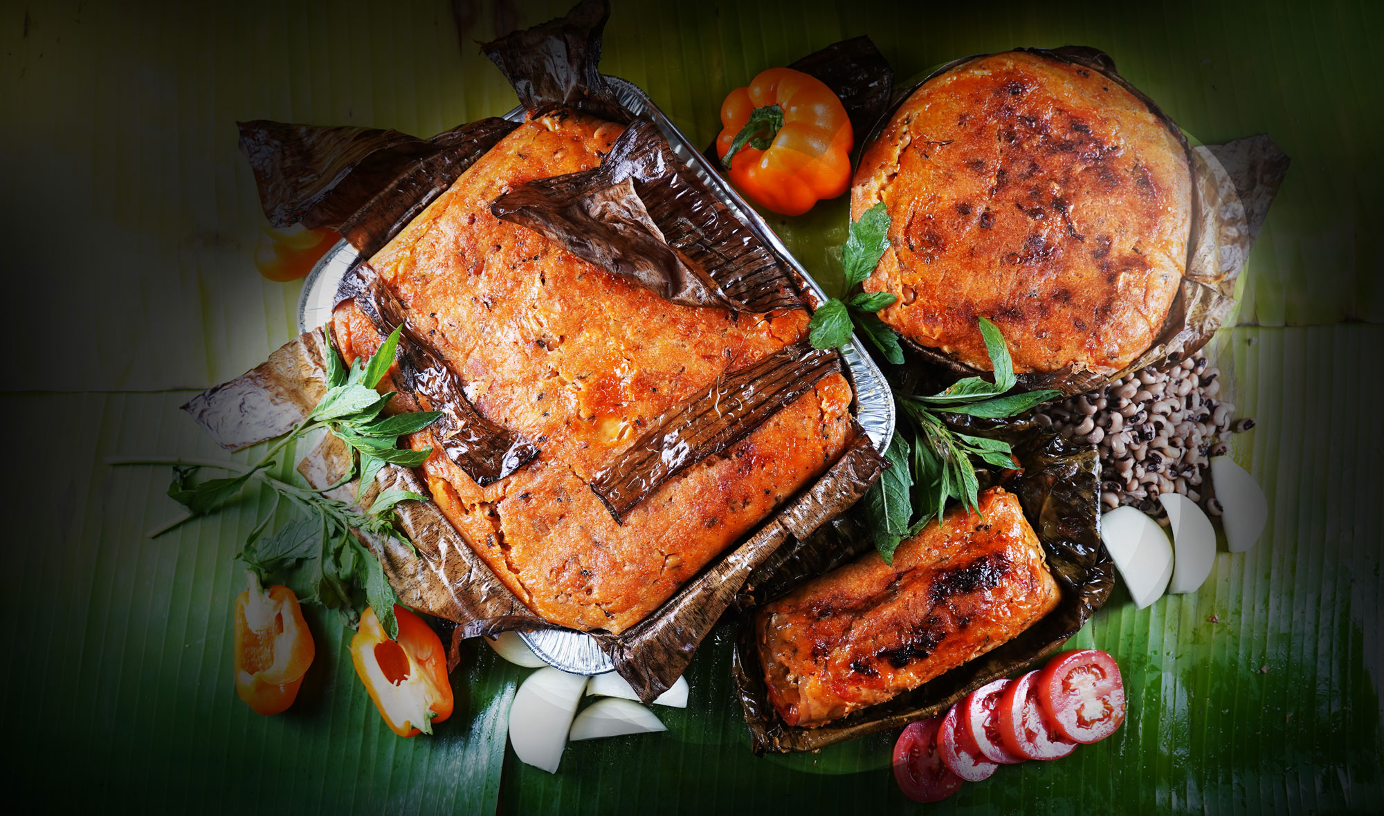 three different sized mucbipollos steamed large tamales