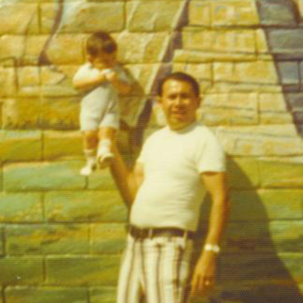dad holding up baby