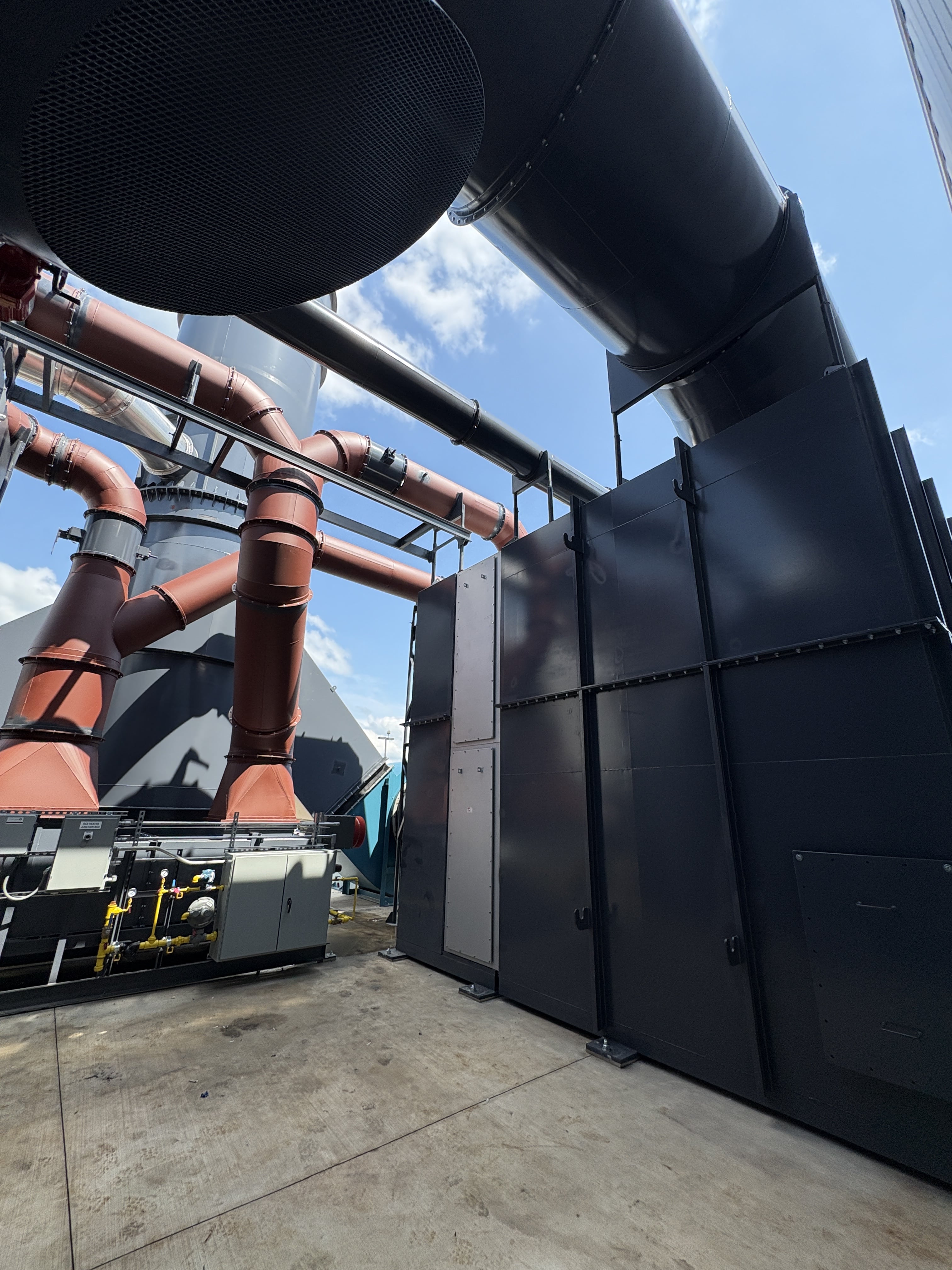 Close up view of VOC rotary concentrator piping installation for automotive manufacturer