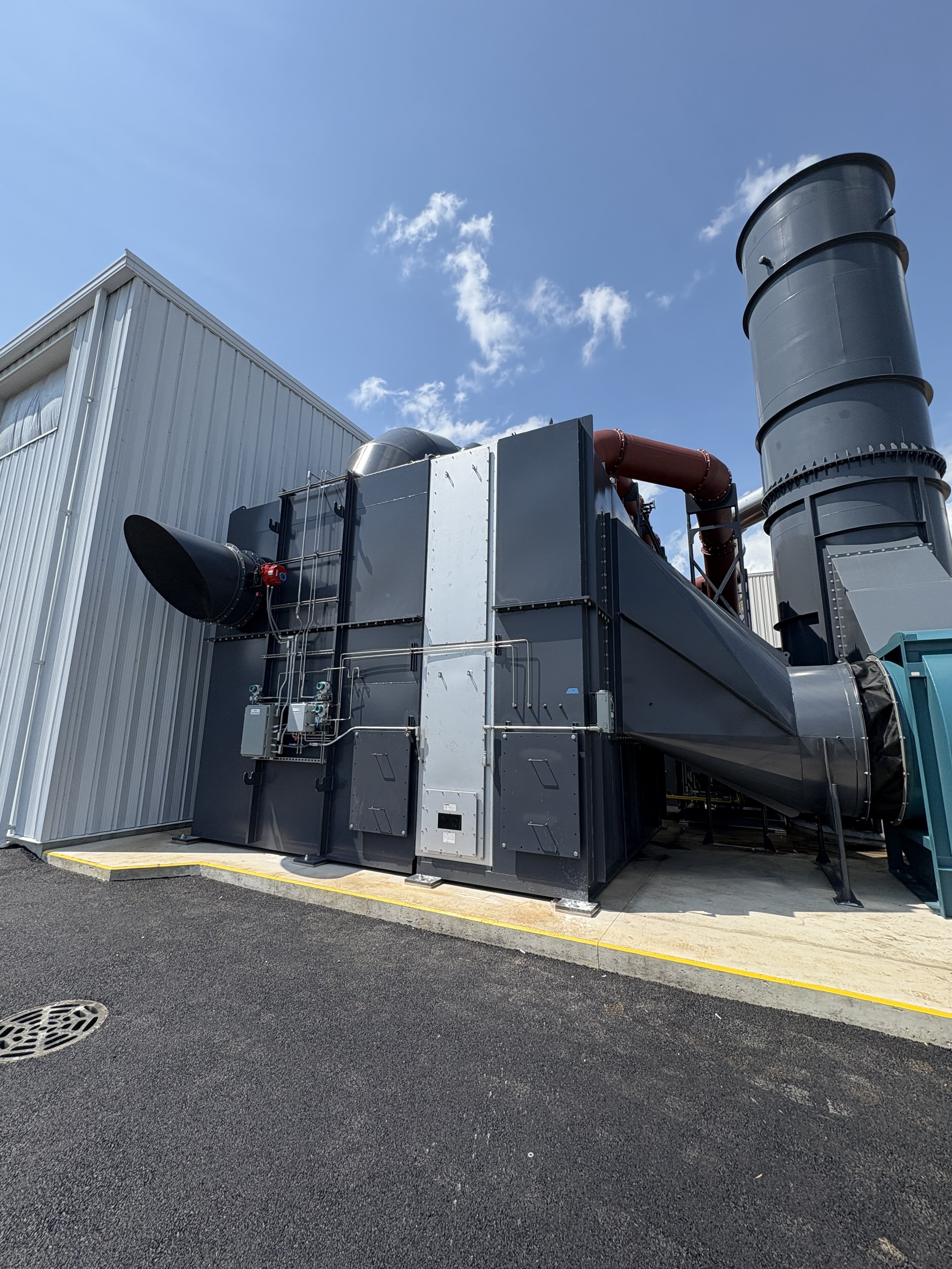 Side exterior view of custom VOC rotary concentrator installed for automotive manufacturer