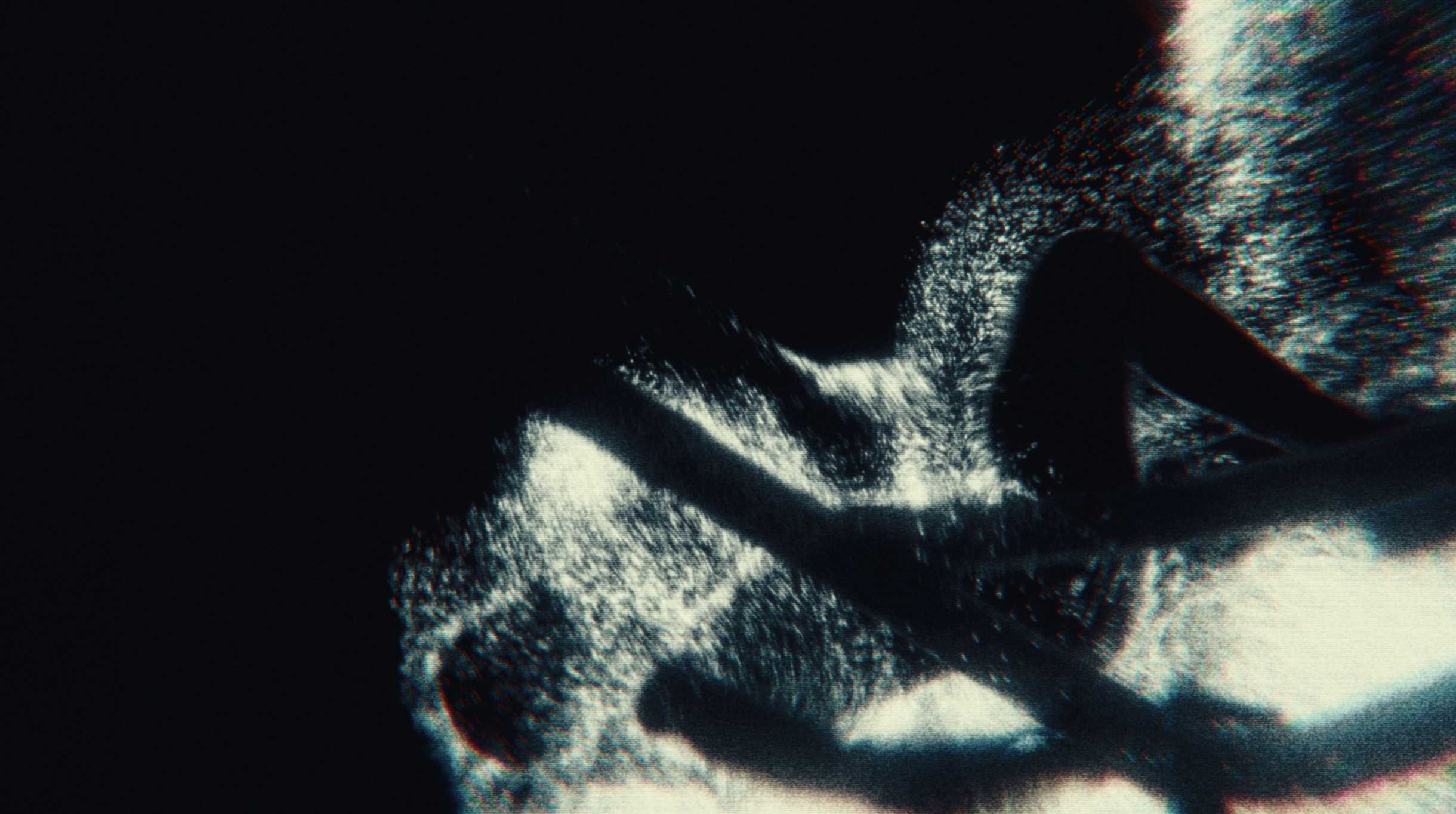 Abstract glitch of particle light forms twisting through darkness
