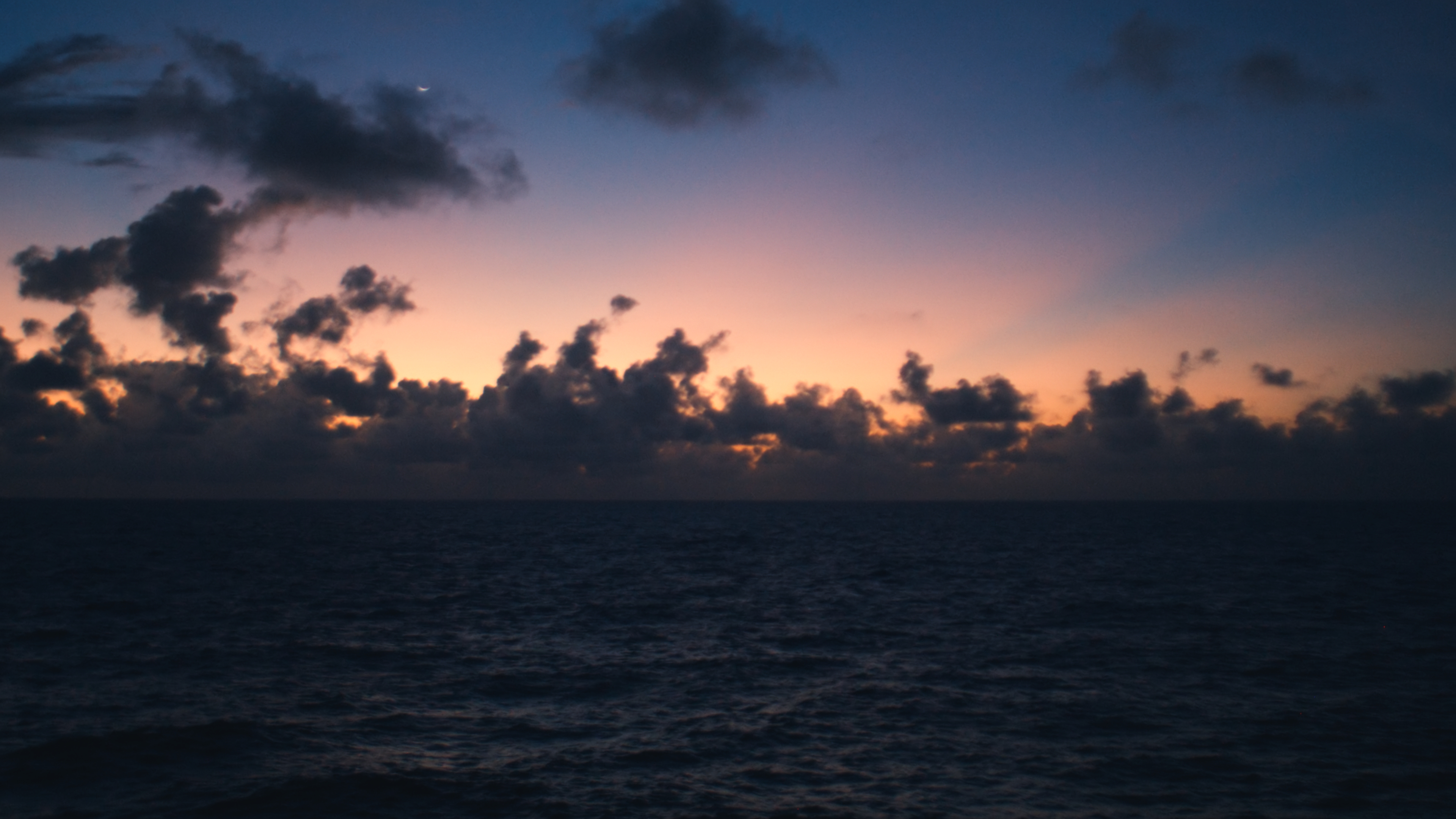 Storm clouds gathering at dawn over the Caribbean Sea
