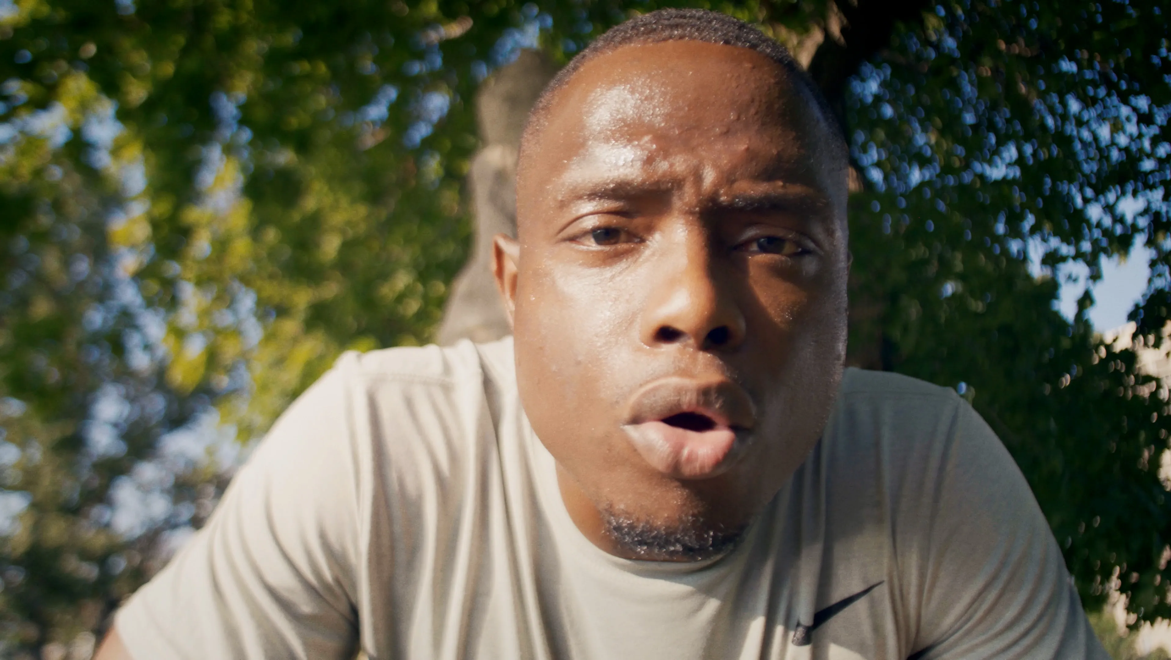 Close-up of a runner breathing hard mid-effort