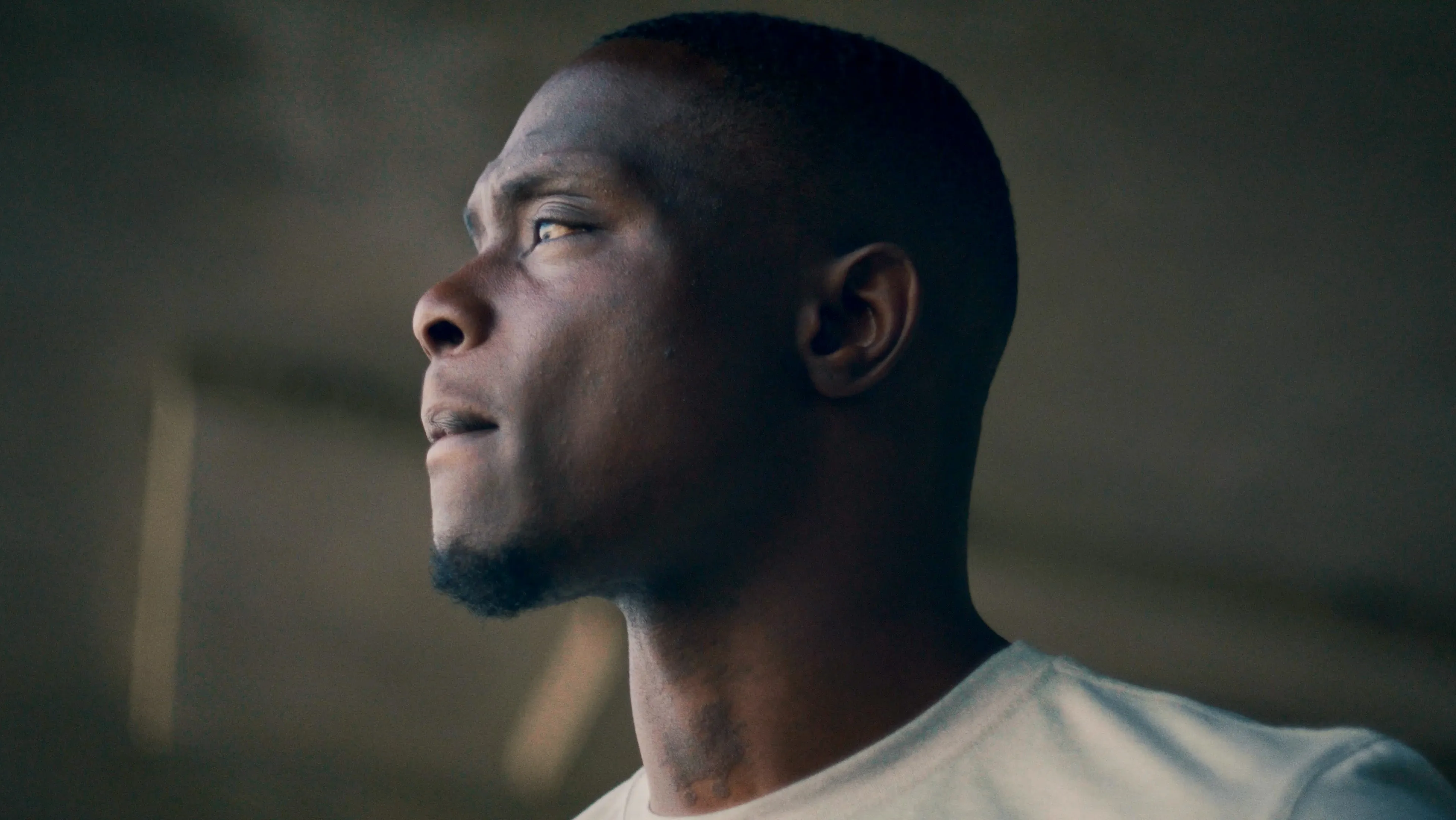 Profile of a runner in dramatic side light