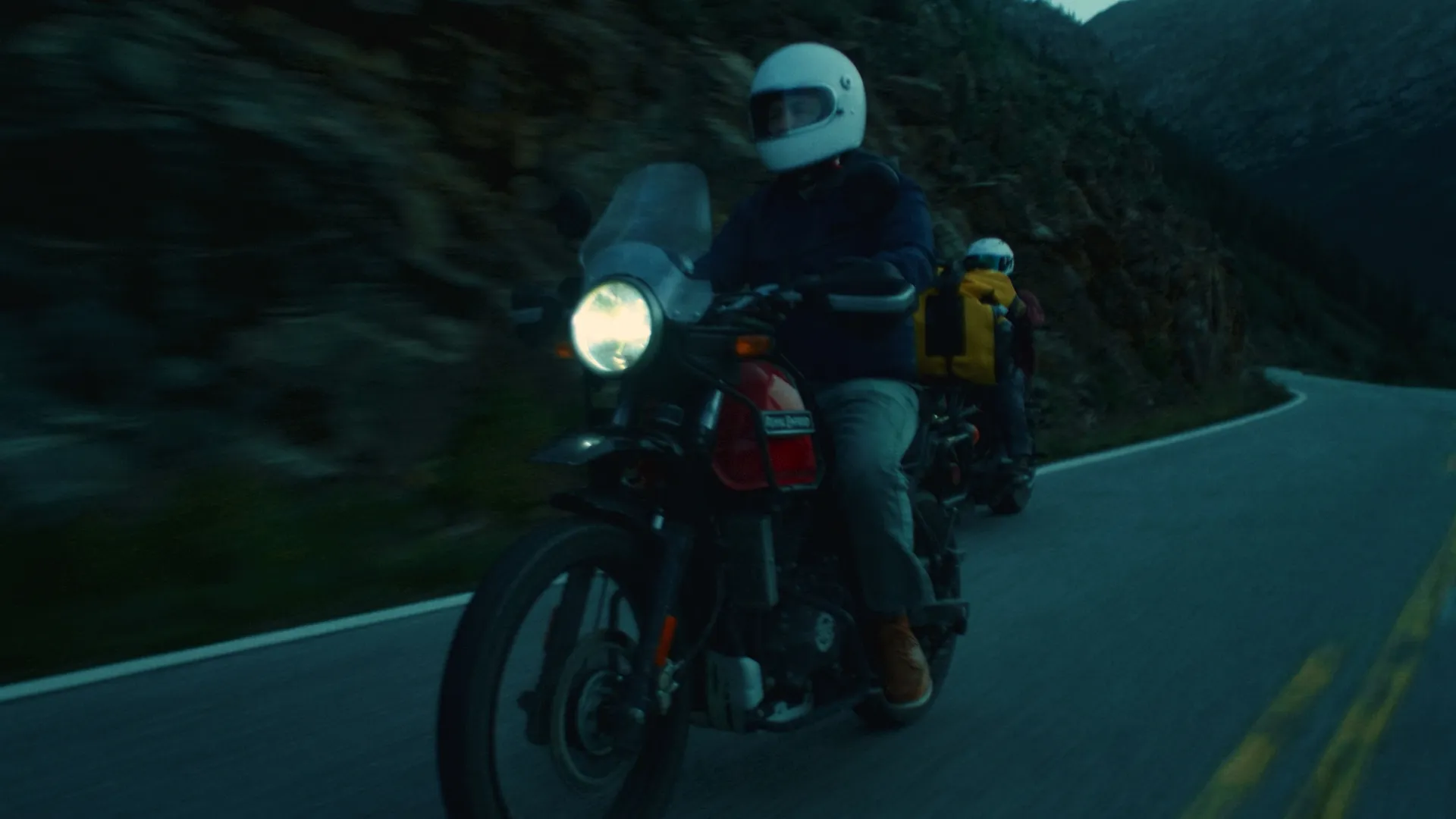 Rider in a white helmet on a mountain pass
