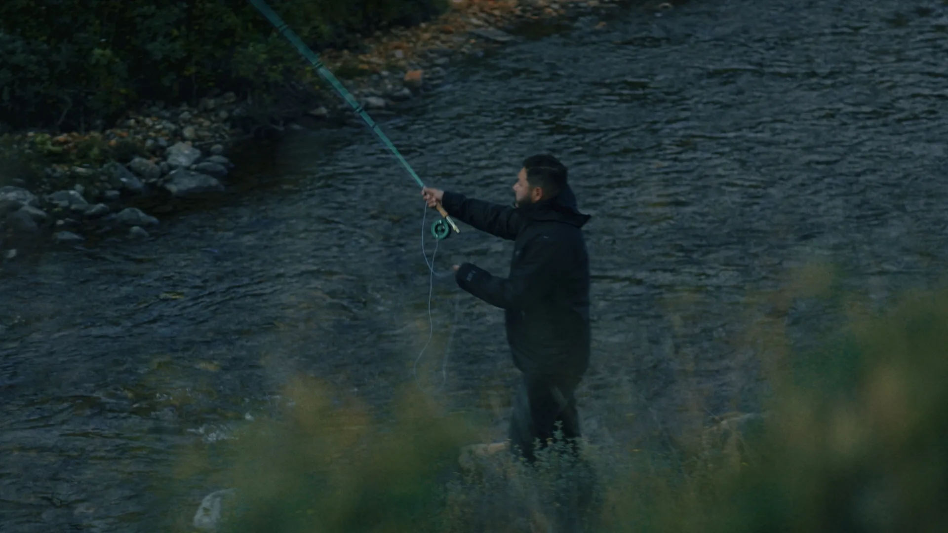Man fly fishing on a rocky river