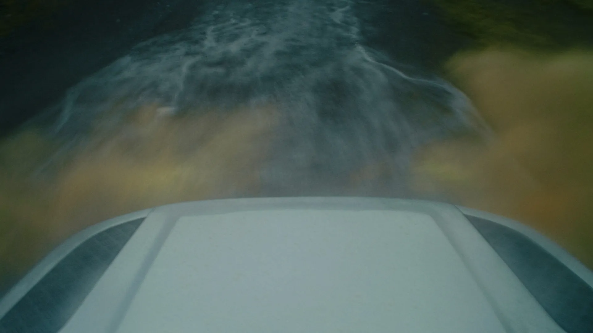 View over the Defender's hood while crossing a river