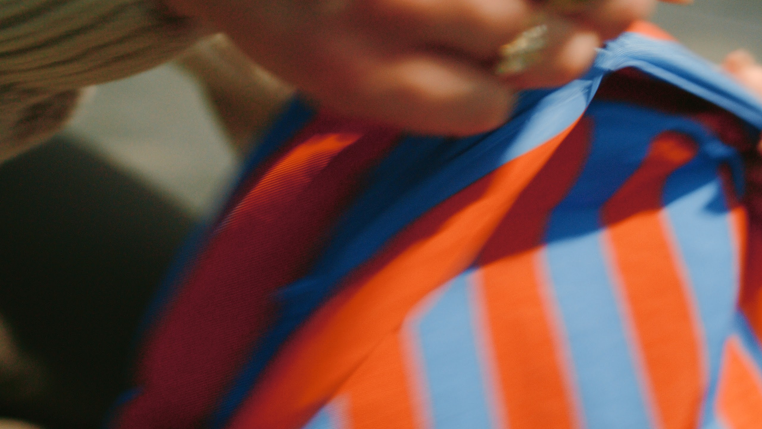 Close view of a striped STORQ backpack