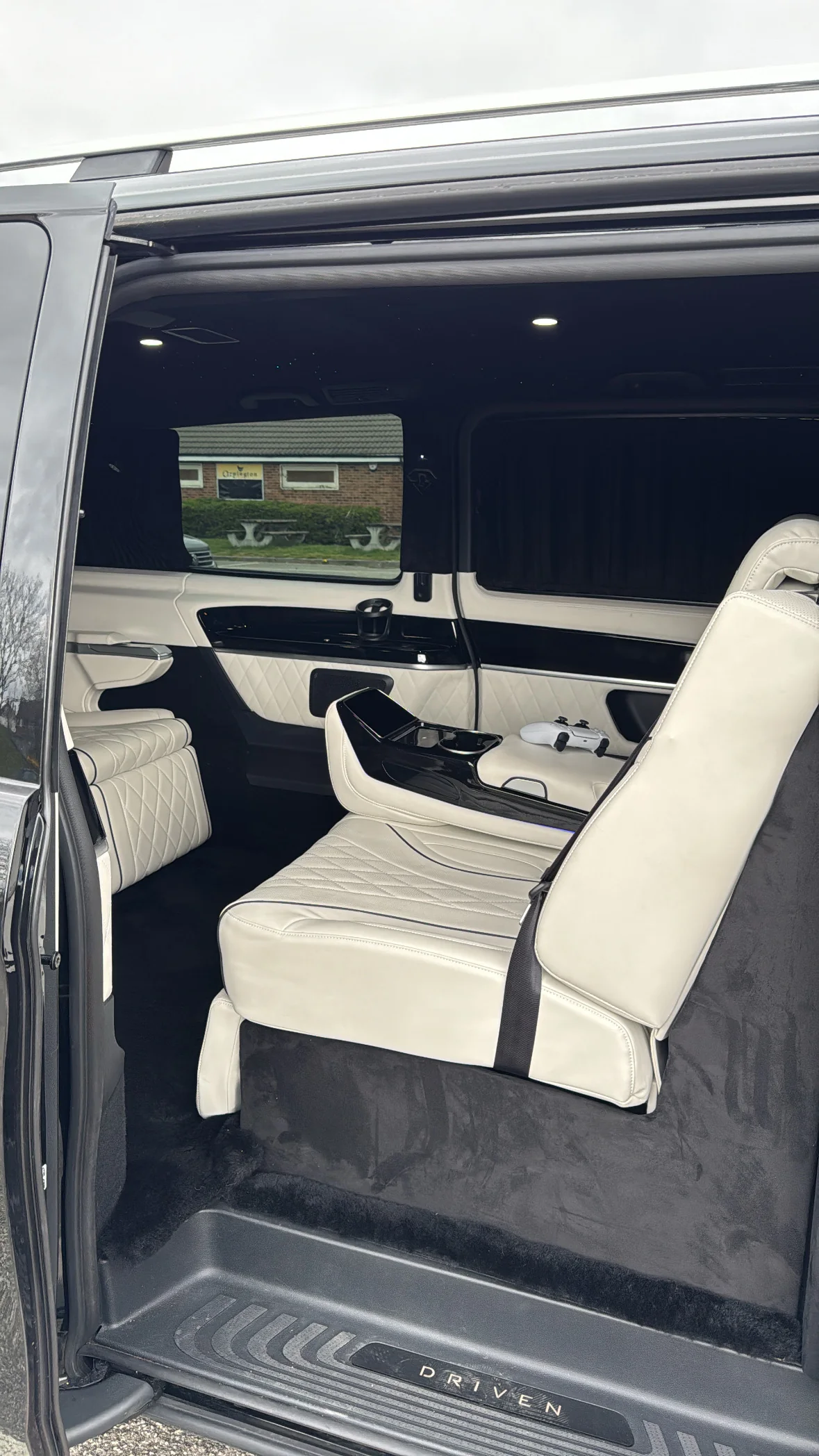 Premium cream chauffeur seats inside a luxury vehicle