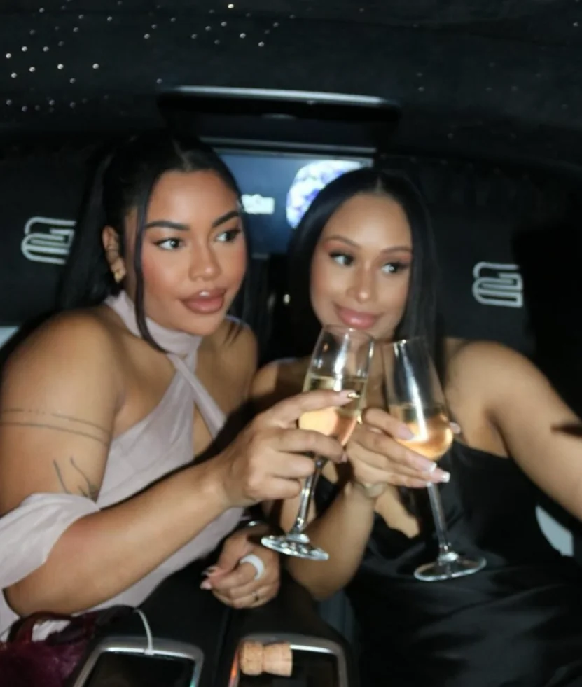 Friends enjoying drinks inside a Veloria chauffeur cabin