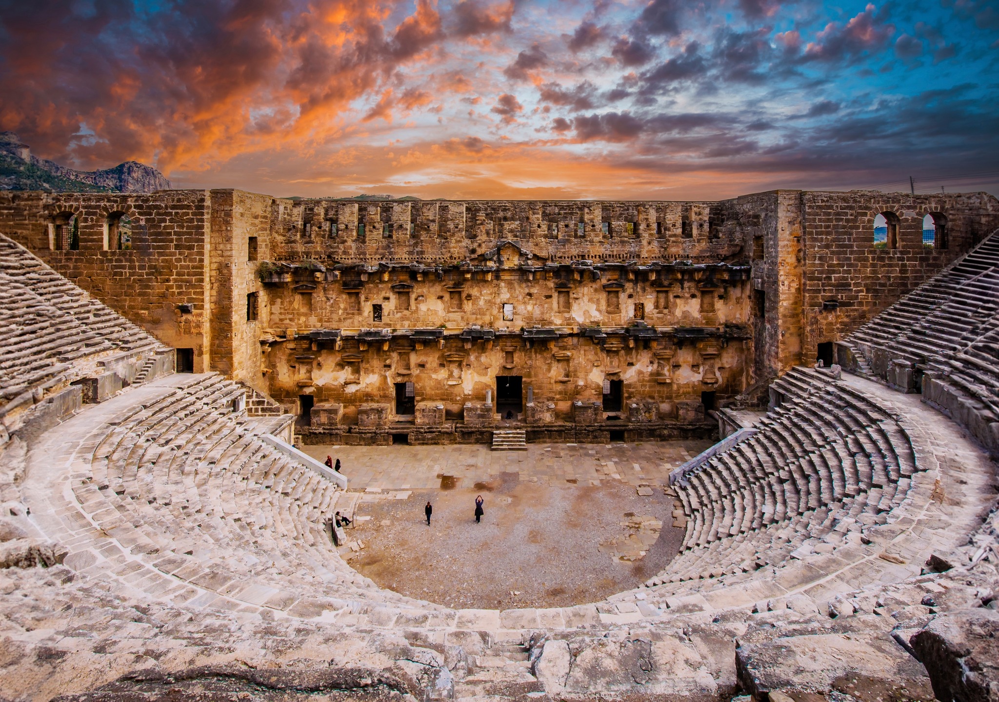 A sunset view of the historical Aspendos theater stage.