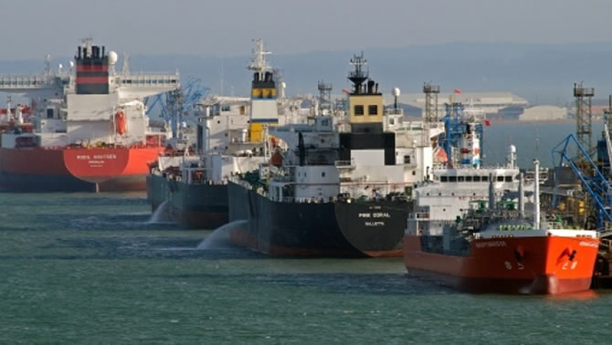 A picture of oil tankers sitting in dock.