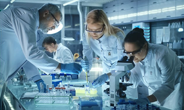 Scientists working in a lab. 