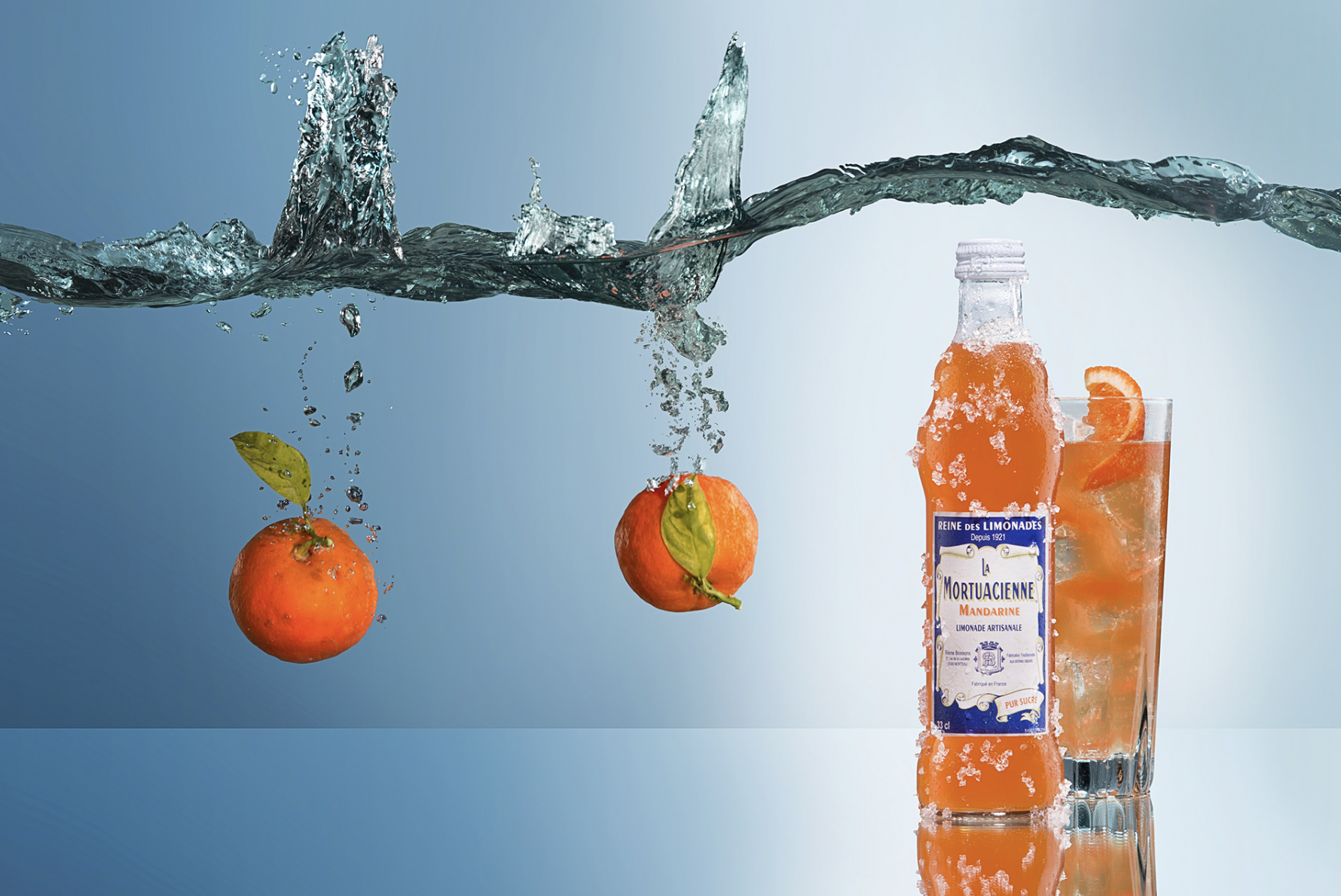 Refreshing French soda served in a glass during lifestyle scene with La Mortuacienne branding