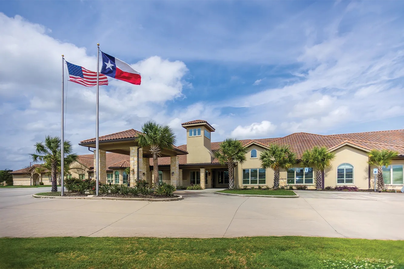 Front entrance of the Cathedral Life Centre with American and Texas flags