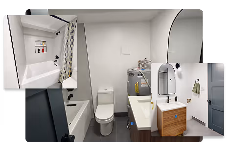 Compact bath with tub-shower and niche, slim vanity with arched mirror, gray floor, and stacked laundry beside the toilet.