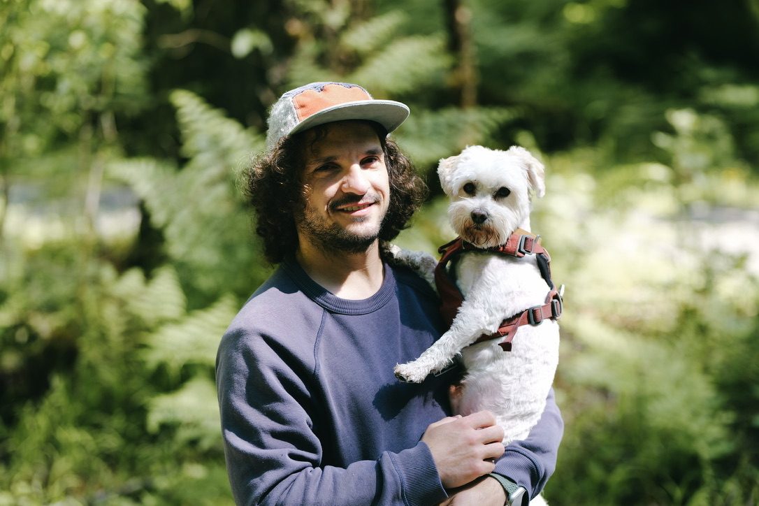 Angelo holding Dante on a forest hike