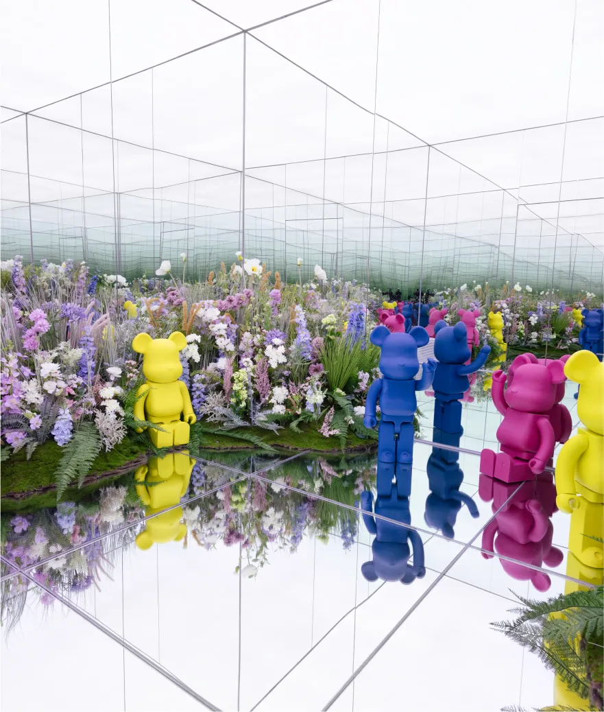 The Parisian Macau replica Eiffel Tower illuminated with colorful lights and fireworks at night.