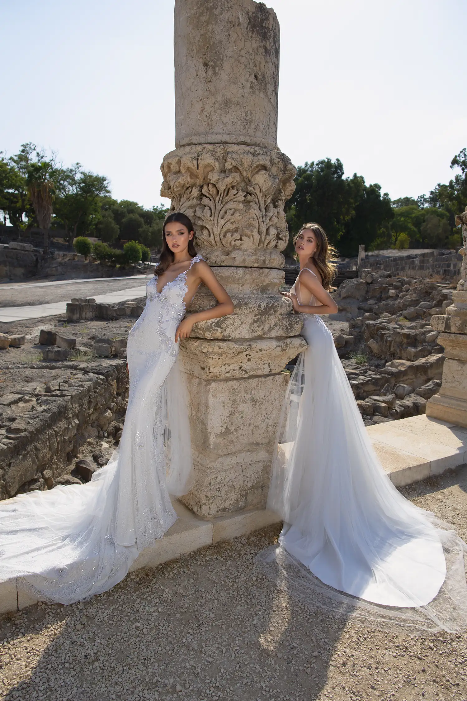 Lace sheath gown with dimensional silver sequin floral applique and detachable draped soft tulle cape