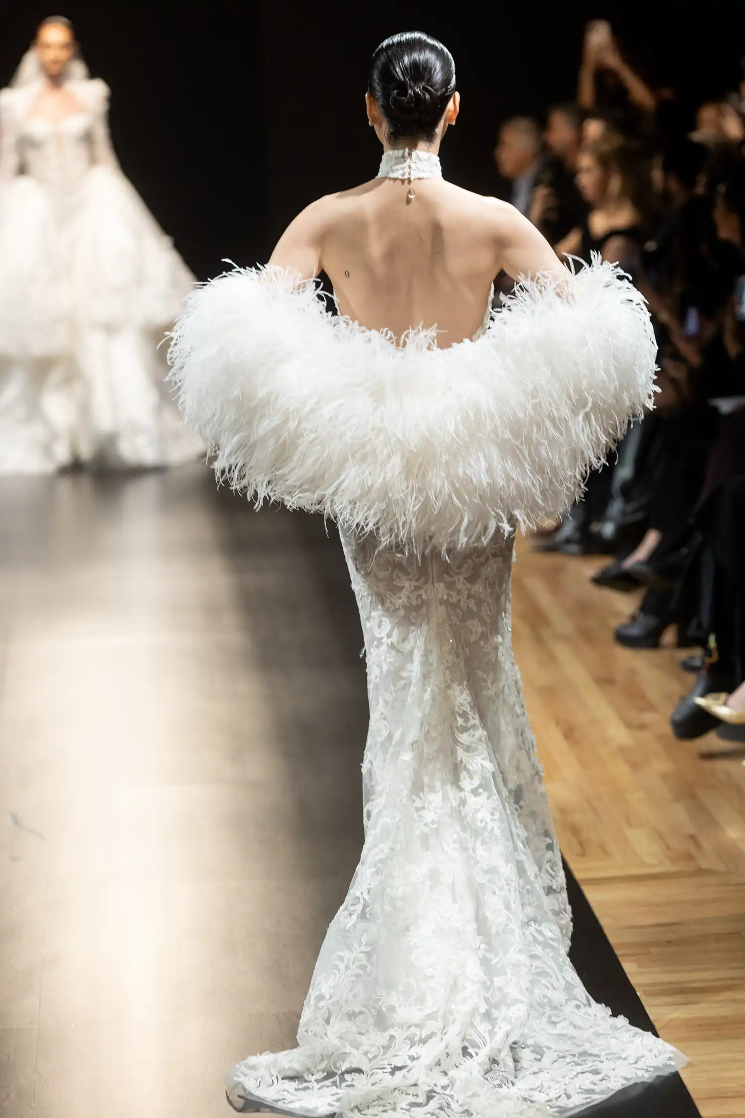Halter sheath gown in beaded, dimensional flower embroidered boroque lace with hanging water crystal droplets. Shown with ostrich feather stole.