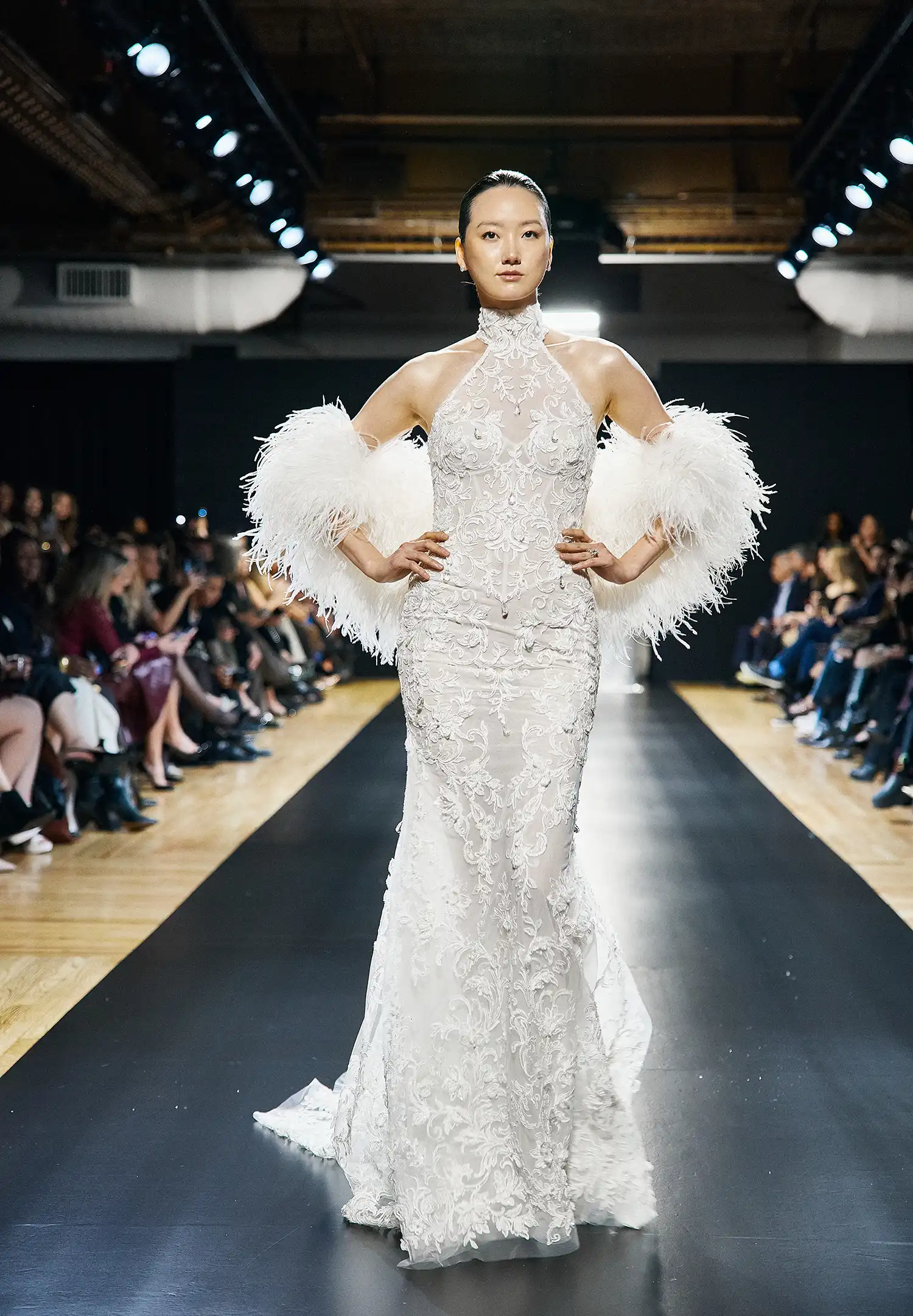 Halter sheath gown in beaded, dimensional flower embroidered boroque lace with hanging water crystal droplets. Shown with ostrich feather stole.