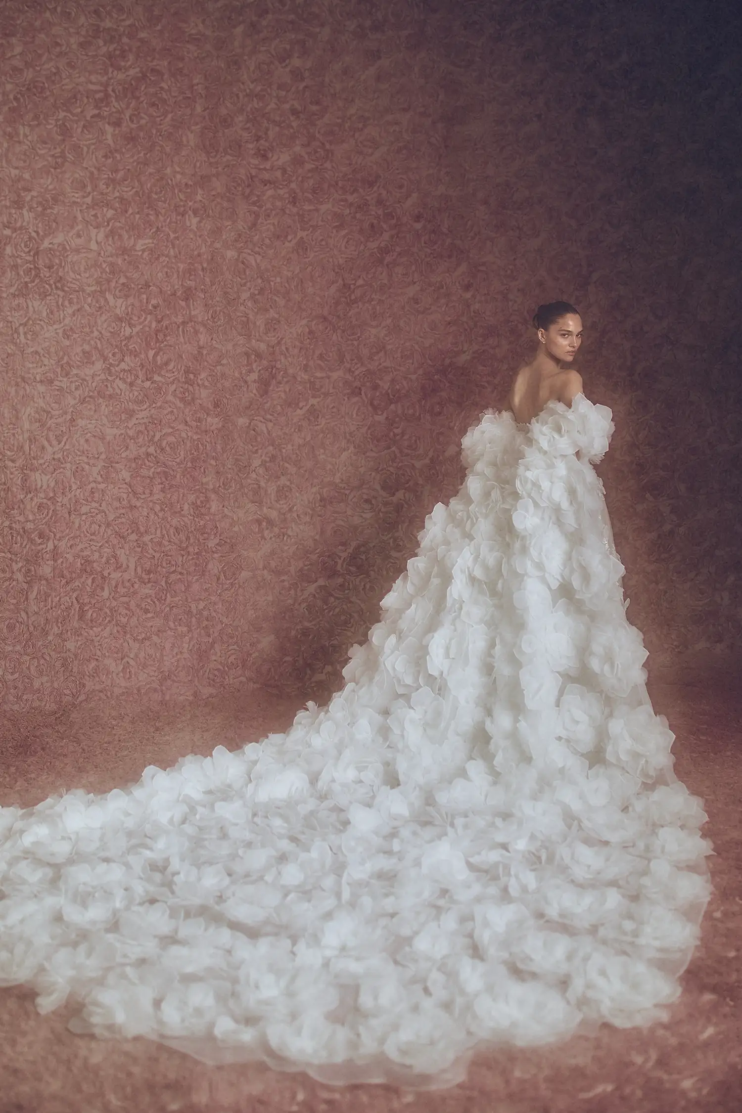 Strapless V neckline embroidered and beaded lace A-line gown with organza petals, shown with matching dimensional organza flower cape.