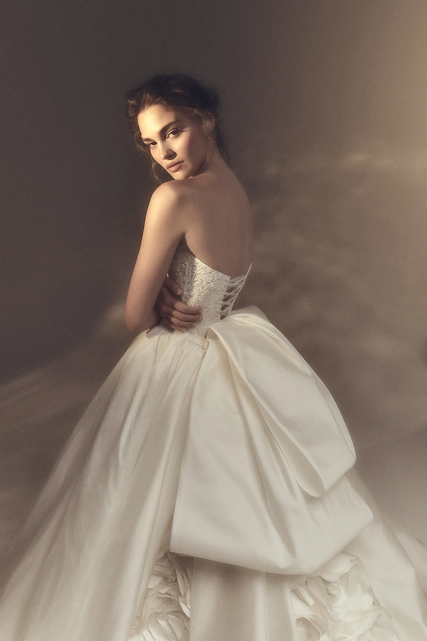 Crescent neckline strapless taffeta and beaded lace ballgown with oversized handmade rose train.