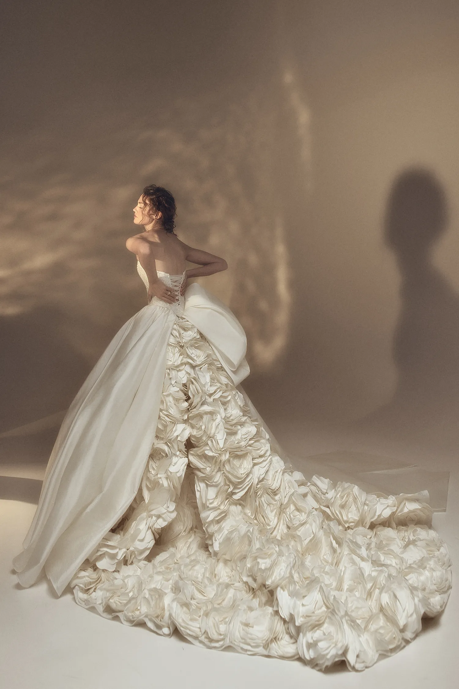 Crescent neckline strapless taffeta and beaded lace ballgown with oversized handmade rose train.