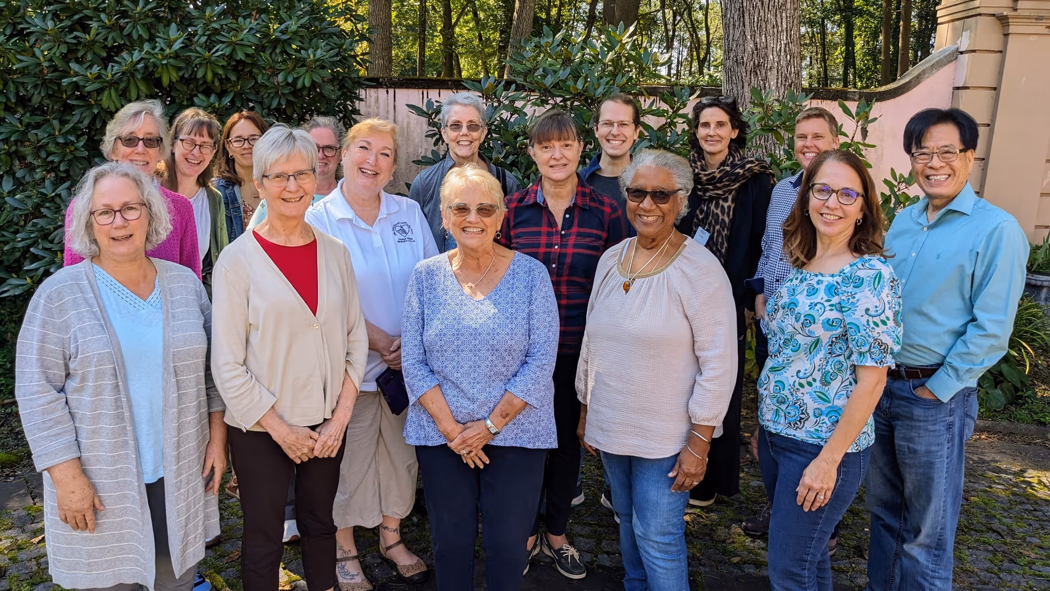 A group of people that are member of Gateways to God pose for a photo