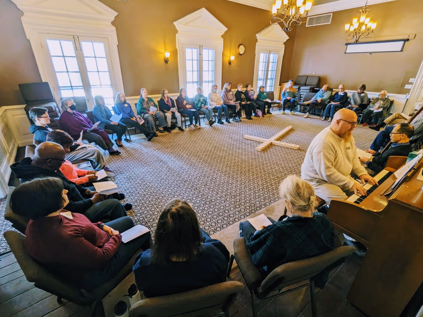 Participants sit in a circle during a Taize Lenten retreat
