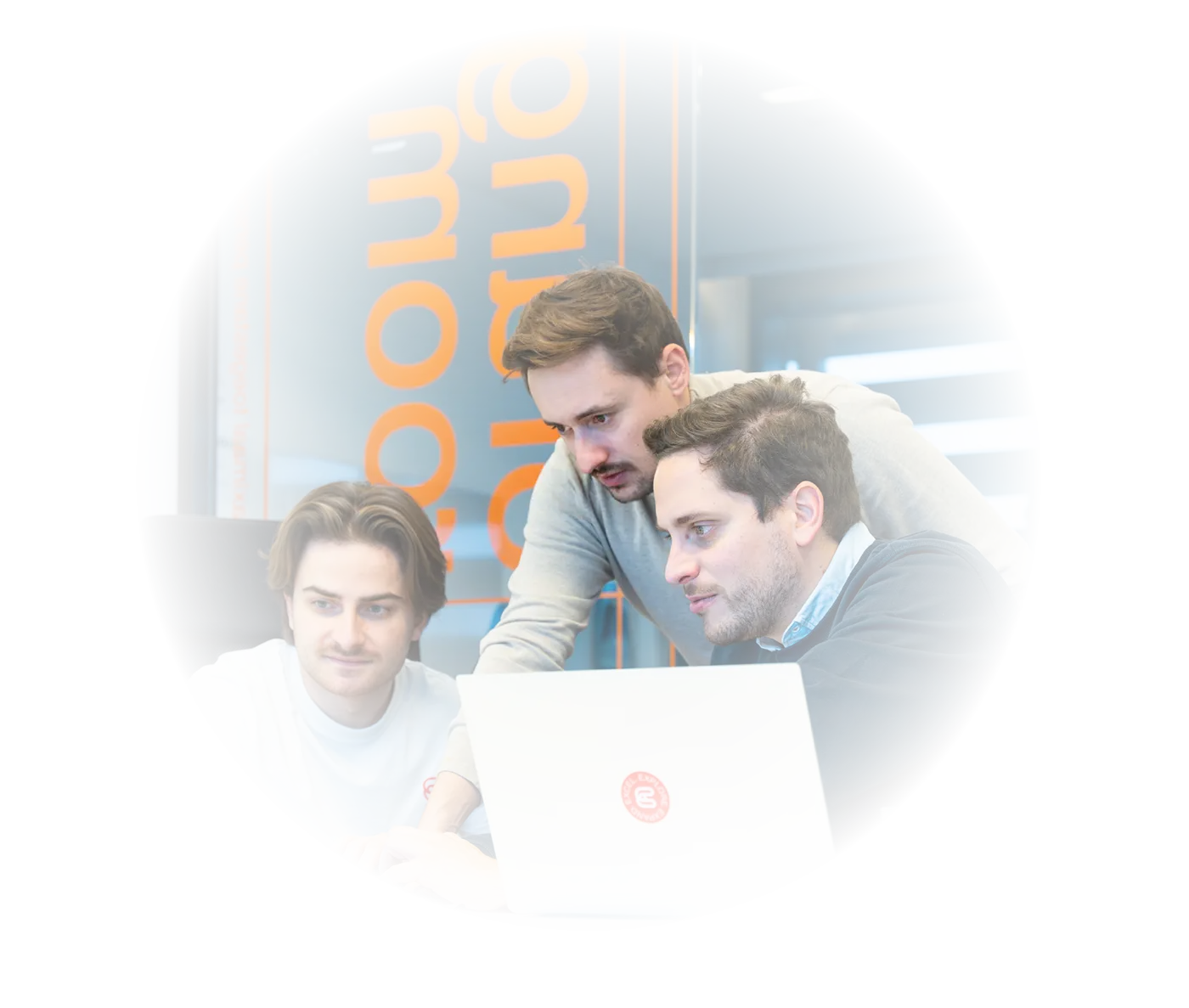 Photo of 3 Coretecs members working in the office.