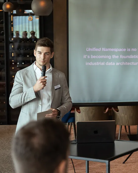 Photo of MP Mathias taken at the UNS Executive Summit 2025 while presentig the intro of the event.