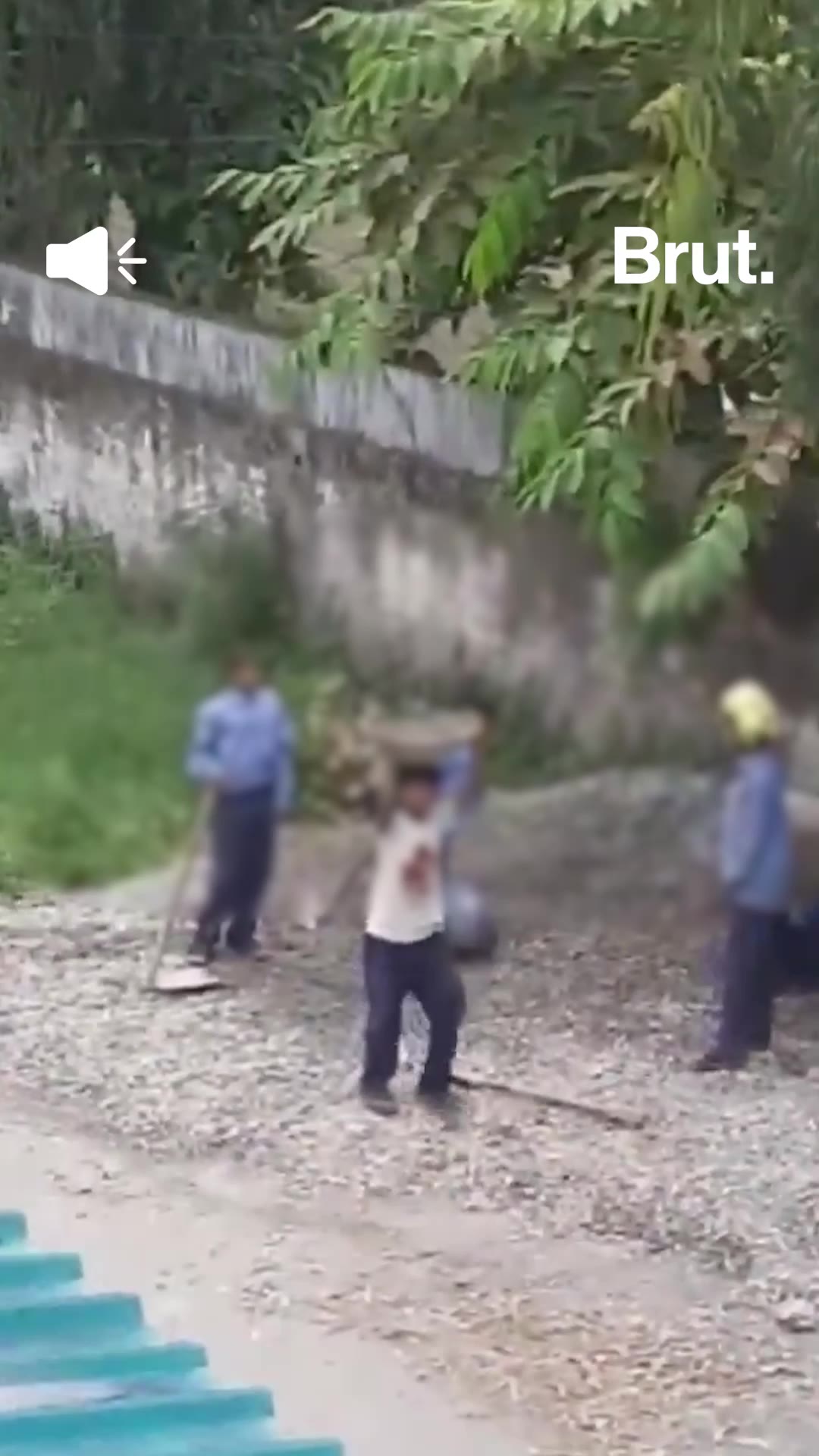 Students carry sand and gravel in Dehradun