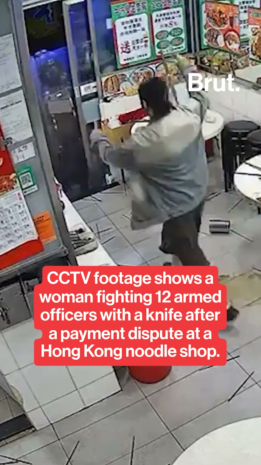Woman fights 12 police officers in Hong Kong noodle shop
